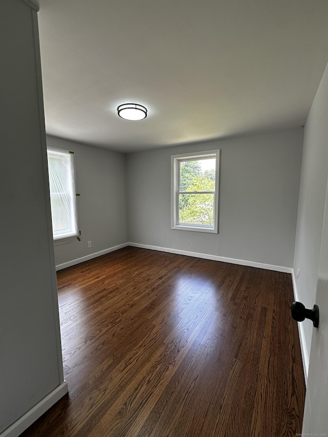 2308 N Main St, Waterbury, CT 06704 - empty room featuring dark wood-style flooring