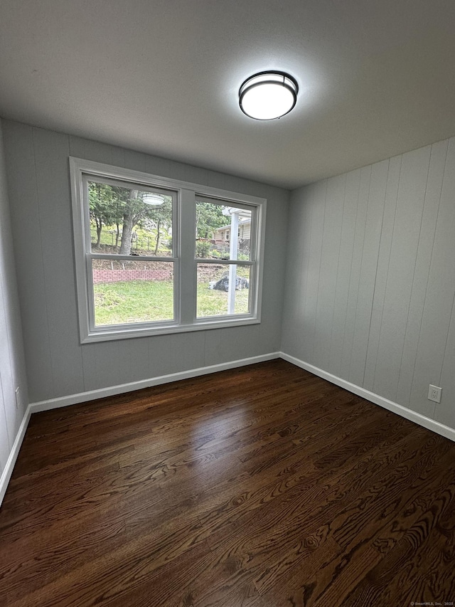 2308 N Main St, Waterbury, CT 06704 - unfurnished room with dark wood-style floors and healthy amount of natural light