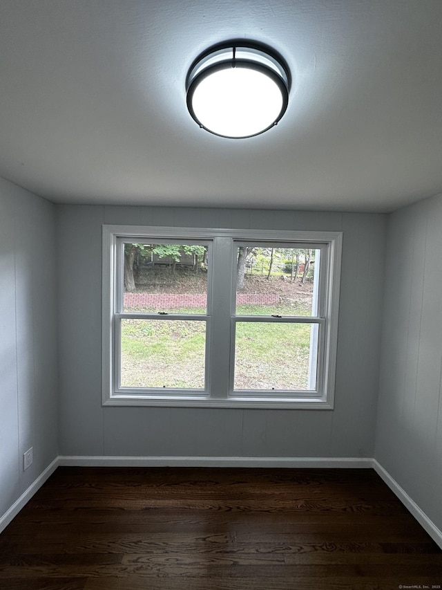 2308 N Main St, Waterbury, CT 06704 - empty room featuring dark wood finished floors and baseboards