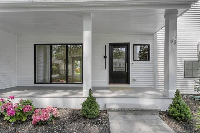 92 Westwood Rd, Fairfield, CT 06825 - doorway to property featuring covered porch