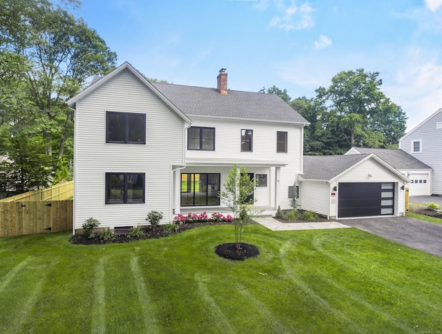 92 Westwood Rd, Fairfield, CT 06825 - modern inspired farmhouse with a chimney, driveway, an attached garage, and a shingled roof