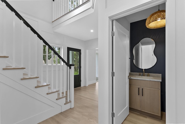 92 Westwood Rd, Fairfield, CT 06825 - foyer featuring light wood-style floors, stairs, and recessed lighting