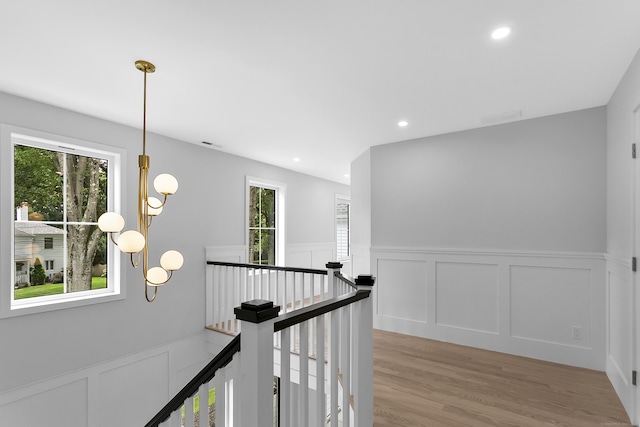 92 Westwood Rd, Fairfield, CT 06825 - hallway featuring a decorative wall, an upstairs landing, a wainscoted wall, light wood-style flooring, and recessed lighting
