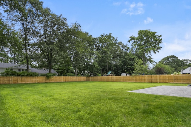 92 Westwood Rd, Fairfield, CT 06825 - fenced backyard with a patio area