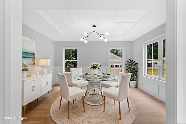 92 Westwood Rd, Fairfield, CT 06825 - dining area with a chandelier, light wood-type flooring, plenty of natural light, and wainscoting