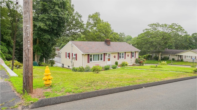 83 View Ter, East Haven, CT 06512 - view of front of house with a chimney and a front lawn