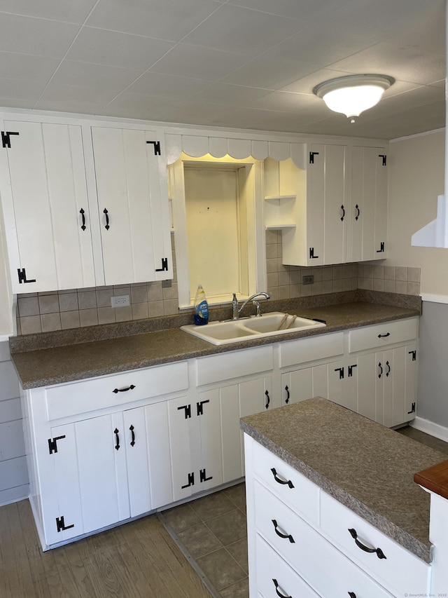 23 Merriman Ln, Prospect, CT 06712 - kitchen with dark countertops, decorative backsplash, and white cabinetry