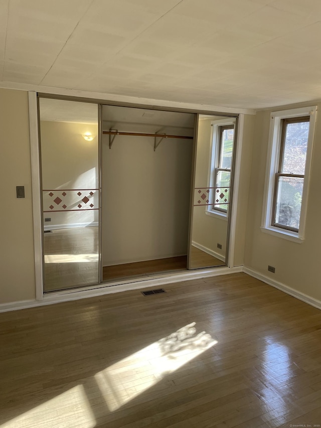 23 Merriman Ln, Prospect, CT 06712 - unfurnished bedroom featuring a closet and wood finished floors