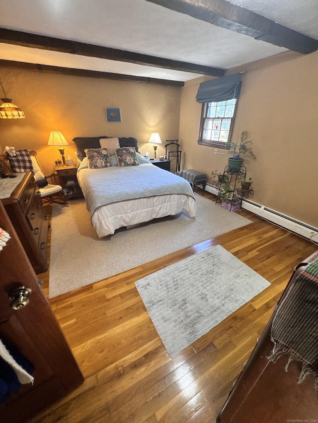 8 Juniper Rd, Windsor, CT 06095 - bedroom with beamed ceiling, wood finished floors, and baseboard heating