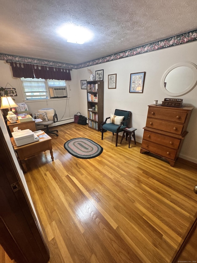 8 Juniper Rd, Windsor, CT 06095 - living room featuring a textured ceiling, wood finished floors, and cooling unit