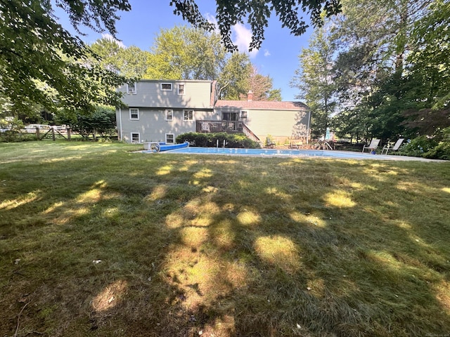 8 Juniper Rd, Windsor, CT 06095 - view of grassy yard featuring a wooden deck and an outdoor pool