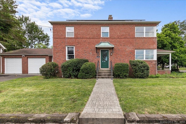 210 Highland Ave, West Haven, CT 06516 - view of front of property with a front yard, brick siding, a garage, asphalt driveway, and a chimney