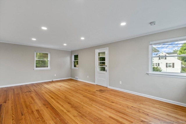 210 Highland Ave, West Haven, CT 06516 - empty room with ornamental molding, recessed lighting, plenty of natural light, and light wood finished floors