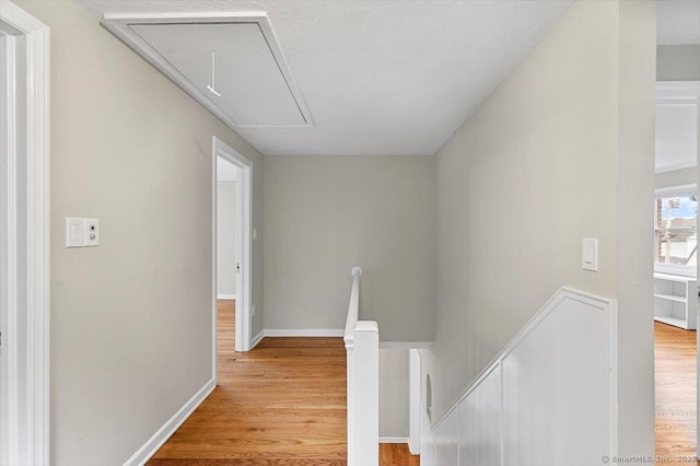 210 Highland Ave, West Haven, CT 06516 - hallway featuring attic access, an upstairs landing, and wood finished floors