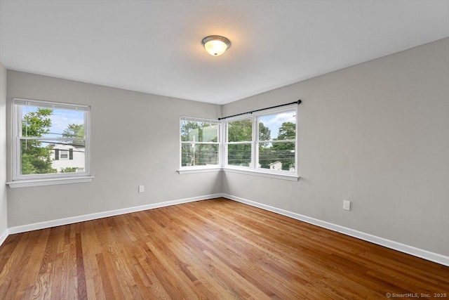 210 Highland Ave, West Haven, CT 06516 - empty room featuring baseboards and light wood-type flooring