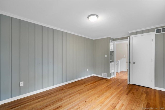 210 Highland Ave, West Haven, CT 06516 - unfurnished bedroom featuring wood finished floors and ornamental molding