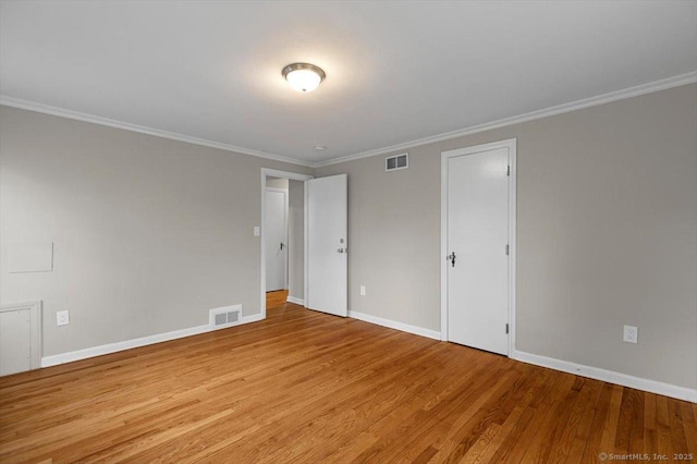 210 Highland Ave, West Haven, CT 06516 - unfurnished bedroom featuring wood finished floors and ornamental molding