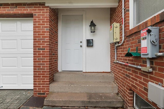 210 Highland Ave, West Haven, CT 06516 - property entrance featuring brick siding and a garage