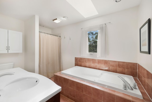 76 Cedarcrest Ct Unit 76, Shelton, CT 06484 - full bath featuring a garden tub, a shower with curtain, a skylight, and vanity