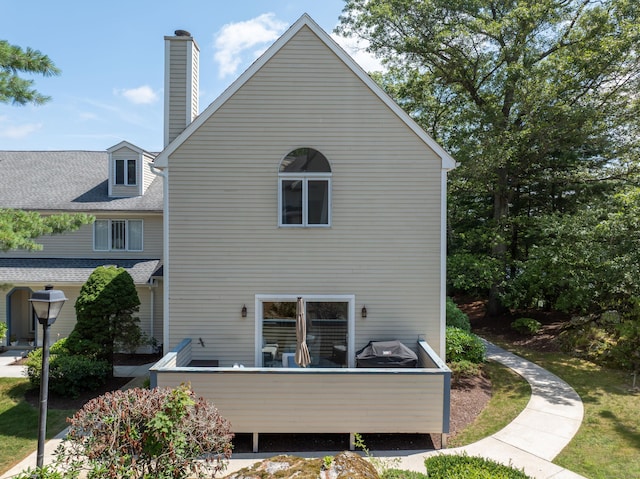 76 Cedarcrest Ct Unit 76, Shelton, CT 06484 - back of property with a chimney and a shingled roof
