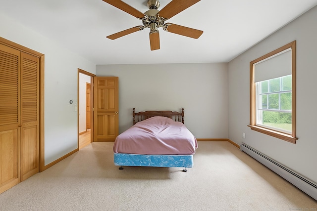 30 Park Rd, Oxford, CT 06478 - carpeted bedroom with a baseboard heating unit, a closet, and a ceiling fan