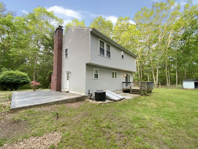 260 Stearns Rd, Mansfield, CT 06268 - back of property with a patio, a wooden deck, a lawn, a chimney, and a shed