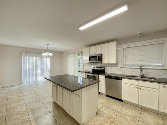 260 Stearns Rd, Mansfield, CT 06268 - kitchen with stainless steel appliances, backsplash, a chandelier, and dark stone countertops