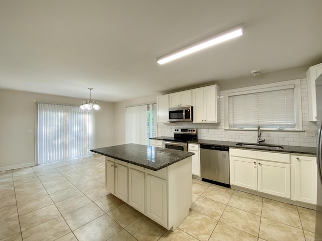 260 Stearns Rd, Mansfield, CT 06268 - kitchen featuring stainless steel appliances, backsplash, a chandelier, and light tile patterned floors