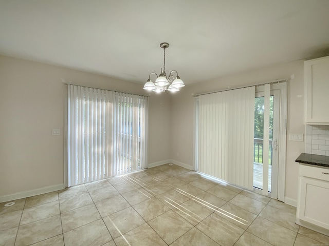 260 Stearns Rd, Mansfield, CT 06268 - unfurnished dining area with a chandelier and light tile patterned flooring