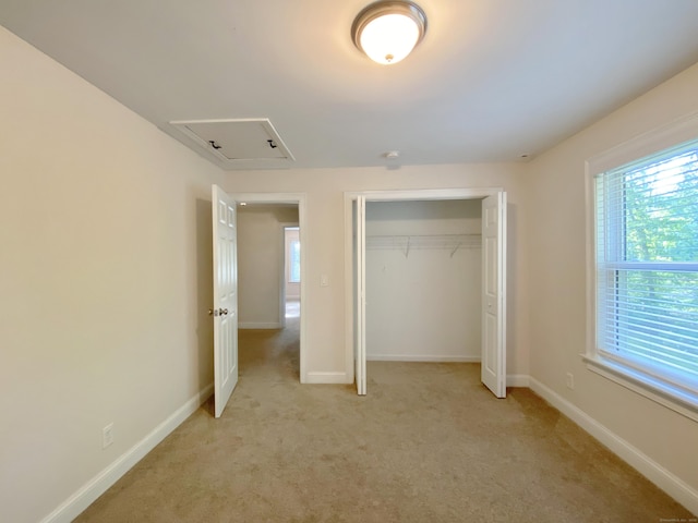 260 Stearns Rd, Mansfield, CT 06268 - unfurnished bedroom featuring attic access, light colored carpet, and a closet