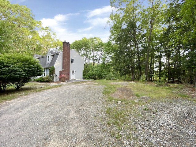 260 Stearns Rd, Mansfield, CT 06268 - view of side of home with driveway and a chimney
