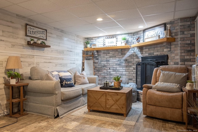 3 Olde Salem Dr, Somers, CT 06071 - living area with a drop ceiling, light wood-type flooring, wood walls, and recessed lighting