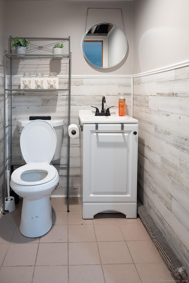 3 Olde Salem Dr, Somers, CT 06071 - half bathroom with vanity, wainscoting, wood walls, and tile patterned floors