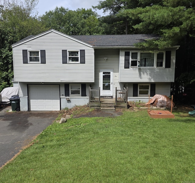 1 Hamill Dr, Winchester, CT 06098 - raised ranch featuring asphalt driveway, a garage, and a front lawn