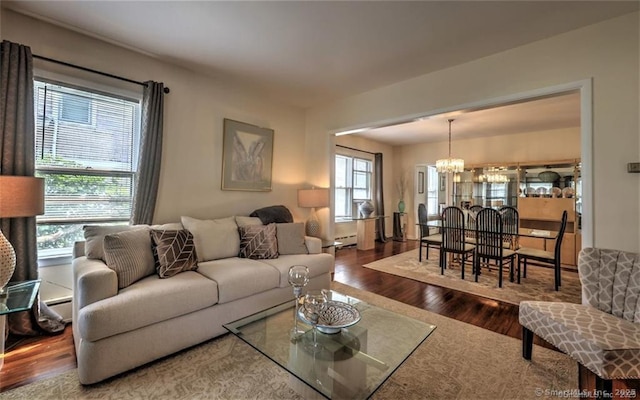 125 Marion St, Bridgeport, CT 06606 - living area with a chandelier, wood finished floors, and a baseboard heating unit
