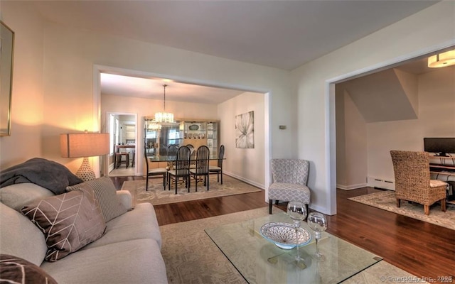 125 Marion St, Bridgeport, CT 06606 - living area with a chandelier, a baseboard radiator, and wood finished floors