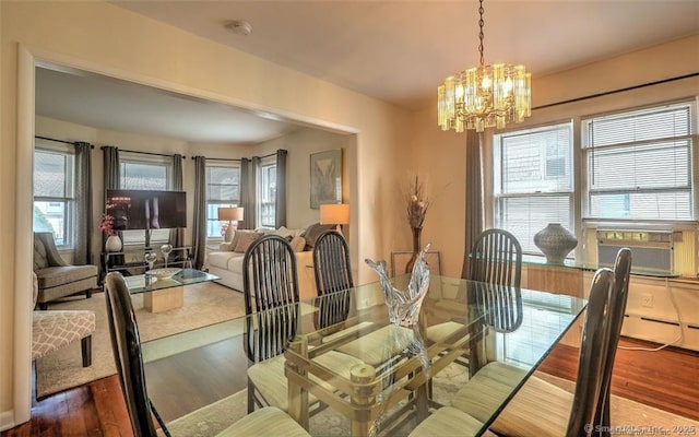 125 Marion St, Bridgeport, CT 06606 - dining space featuring a chandelier, wood finished floors, and cooling unit