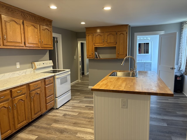 5 Quarry Ln, Portland, CT 06480 - kitchen featuring white range with electric stovetop, butcher block countertops, recessed lighting, wood finished floors, and brown cabinets