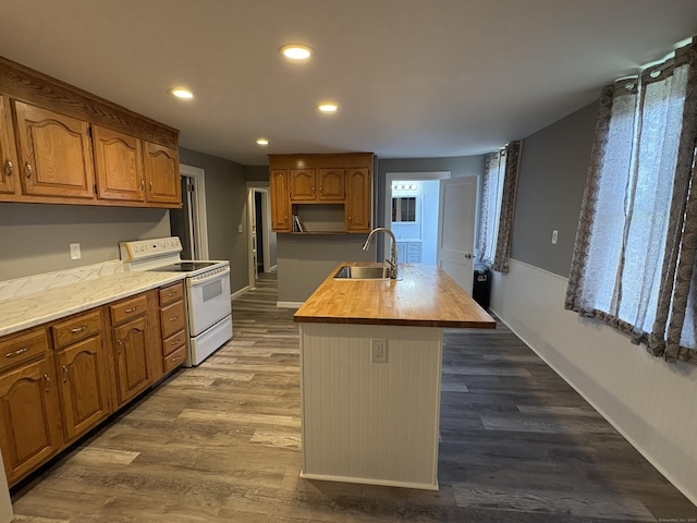 5 Quarry Ln, Portland, CT 06480 - kitchen featuring white electric range, butcher block counters, a center island with sink, dark wood-style floors, and recessed lighting