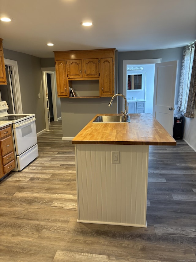 5 Quarry Ln, Portland, CT 06480 - kitchen with white range with electric stovetop, wooden counters, dark wood finished floors, recessed lighting, and brown cabinetry