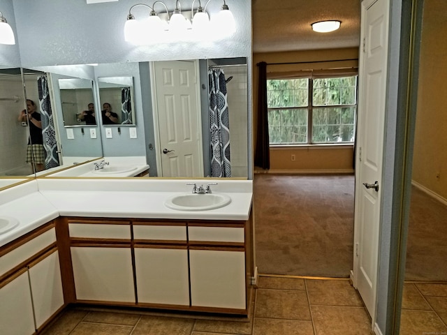 31 High St Apt 11206, East Hartford, CT 06118 - full bathroom with double vanity and tile patterned flooring