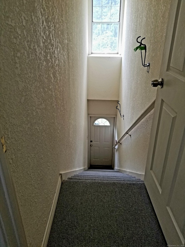 31 High St Apt 11206, East Hartford, CT 06118 - stairway with a textured wall and carpet