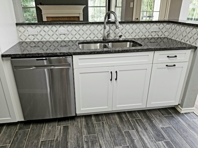 31 High St Apt 11206, East Hartford, CT 06118 - kitchen featuring dishwasher, dark stone counters, wood finish floors, and tasteful backsplash