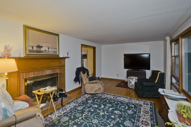 9 Mountain Rd, Granby, CT 06060 - living area featuring a brick fireplace and wood finished floors