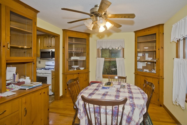 9 Mountain Rd, Granby, CT 06060 - dining area with light wood finished floors and a ceiling fan