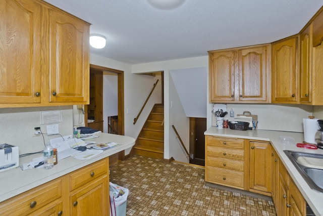 9 Mountain Rd, Granby, CT 06060 - kitchen featuring light countertops and brown cabinetry