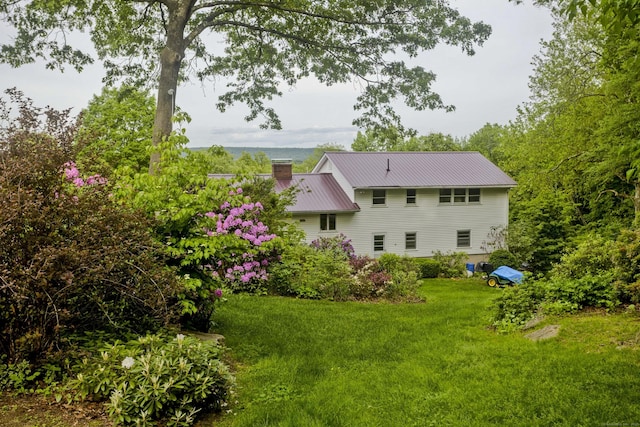9 Mountain Rd, Granby, CT 06060 - back of property with a metal roof, a lawn, and a chimney