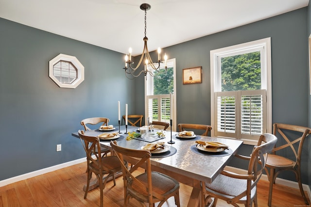 731 N Park Ave, Redding, CT 06896 - dining room featuring wood finished floors and a chandelier