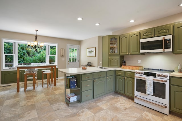 731 N Park Ave, Redding, CT 06896 - kitchen featuring green cabinetry, white appliances, light countertops, a peninsula, and recessed lighting