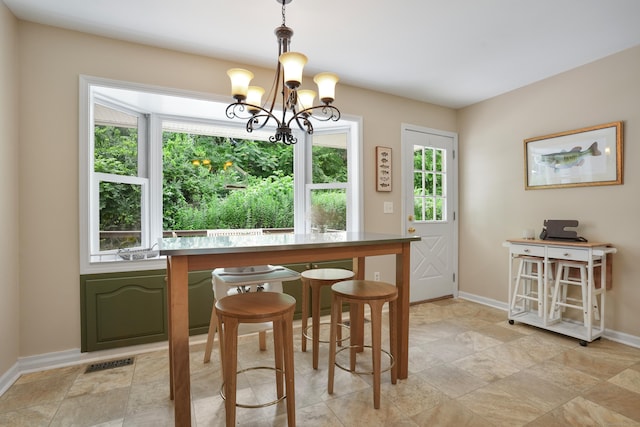 731 N Park Ave, Redding, CT 06896 - dining space featuring plenty of natural light, a chandelier, and stone finish flooring